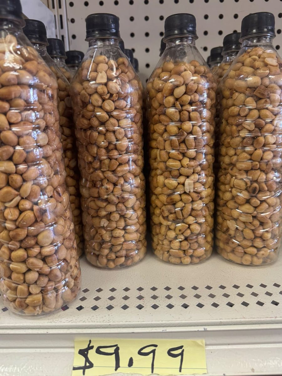 Roasted groundnuts in clear plastic bottles on shelf priced at $9.99