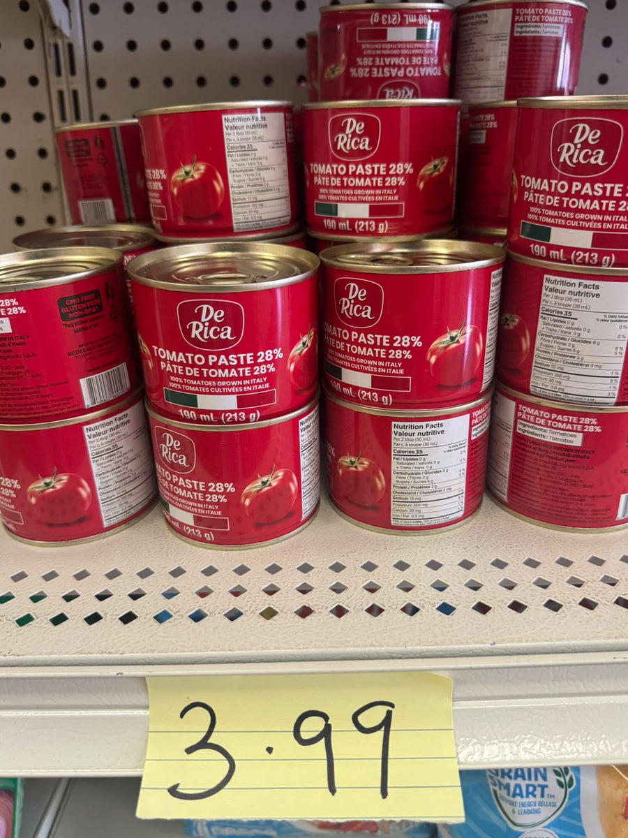 De Rica Tomato Paste 28% cans on shelf